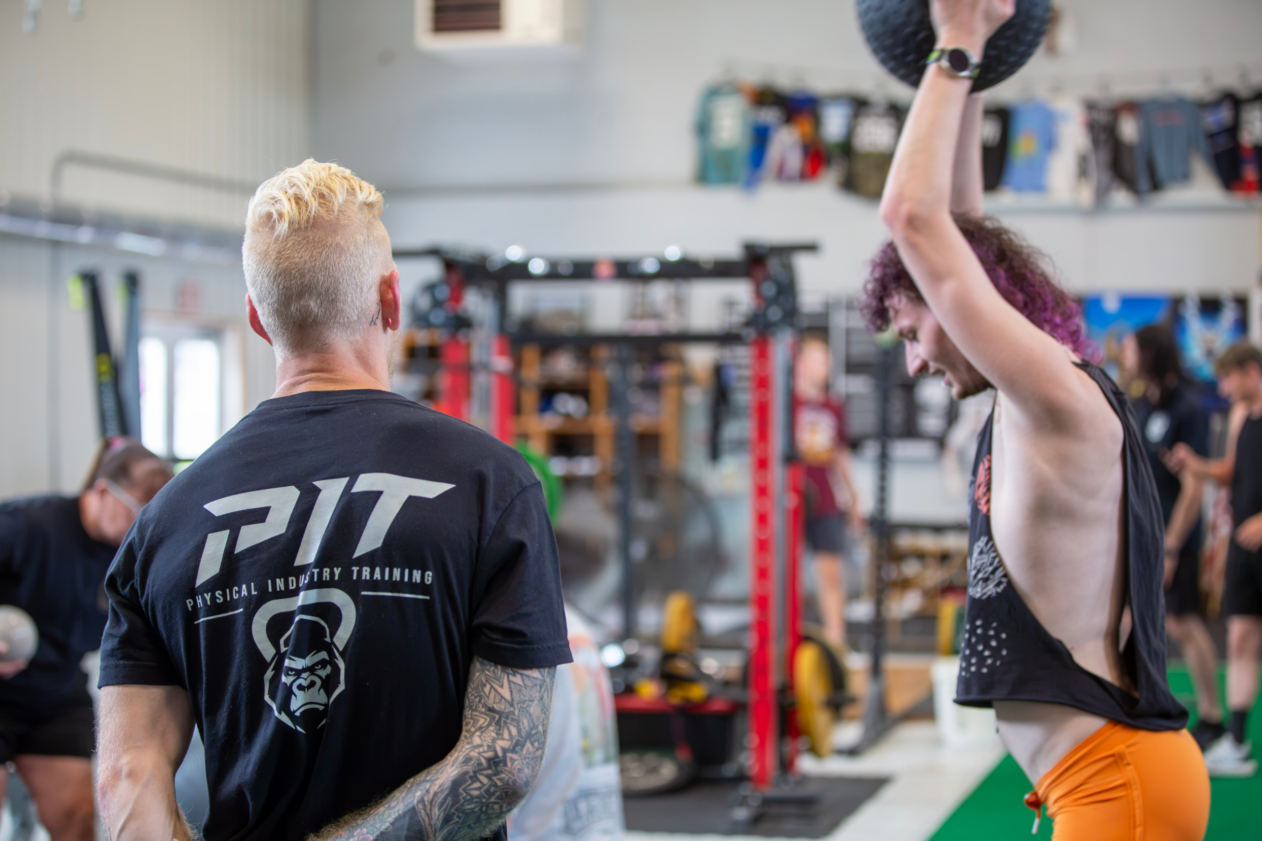 Coach Tom Lavella observing and coaching an athlete at Physical Industry Training