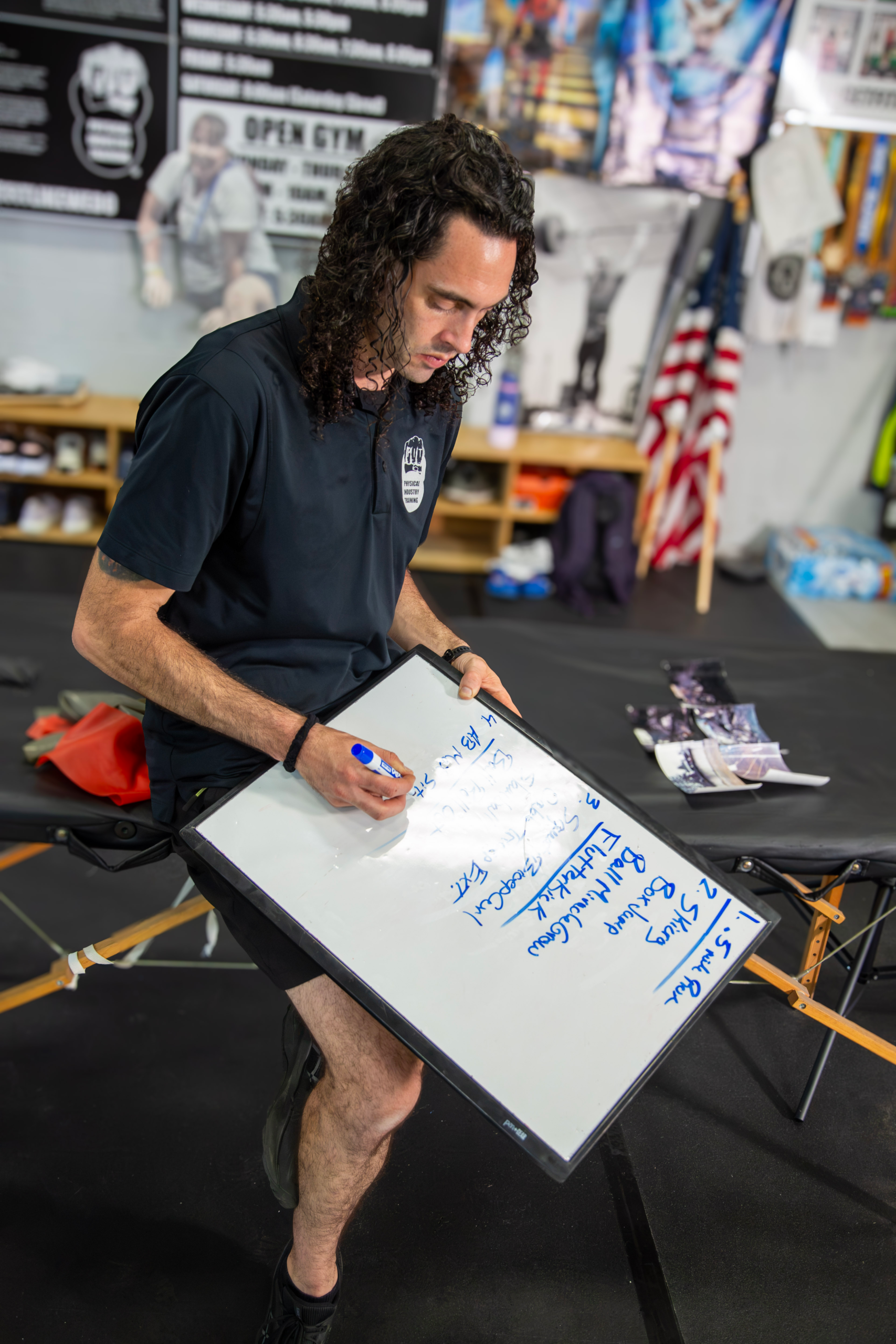 P.I.T. training whiteboard used for programming, coaching plans and workout organization